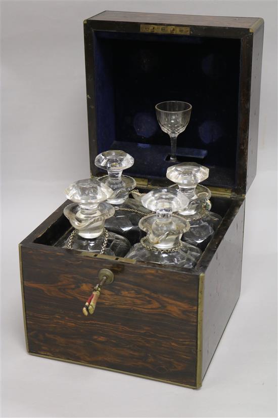 An Aspreys coromandel four-decanter box, fully-fitted, with liqueur glass and retailers label 22 x 22cm